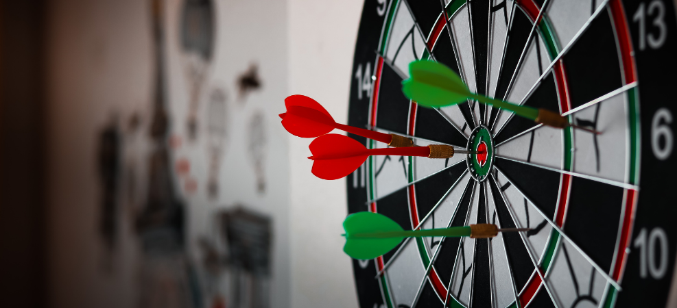 Dartboard with darts on target